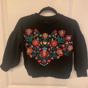 Black crop top sweatshirt with vibrant embroidery